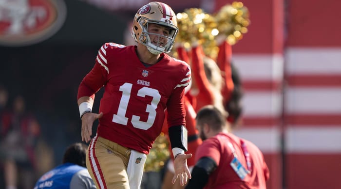Brock Purdy running onto the field in San Francisco